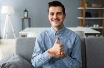 Young man learning sign language