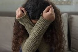 Girl covering face